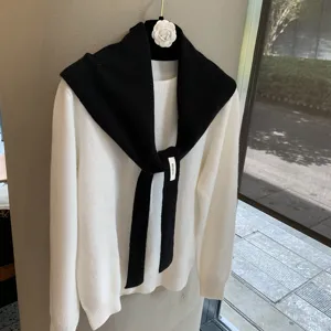 Knitwear layered shawl and fake collar detail view, elegant women winter fashion design.