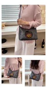 Vue detaillee du sac a bandouliere vintage avec motif floral embosse, parfait pour l'usage.
