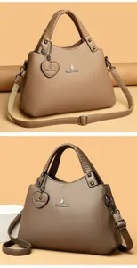 Élégant sac à main pour femme kaki avec poignée supérieure et bandoulière réglable.