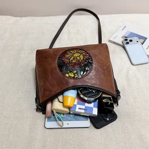 Sac à bandoulière en cuir à fleurs gaufrées vintage, fourre-tout décontracté pour femmes.