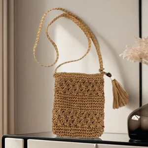 Woven straw crossbody bag for women, stylish small phone bag and casual beach shoulder bag.