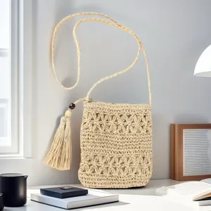 Woven straw crossbody bag for women, stylish beach shoulder bag with tassel and wooden bead.