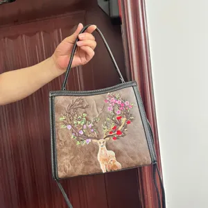 Detailed view of a chic Chinese style embroidered deer shoulder bag, casual everyday handbag.