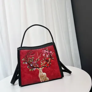Exquisite sika deer embroidery detail, traditional Chinese style, premium red texture.