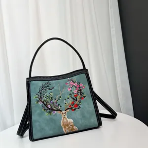 Elegant women's shoulder bag with exquisite embroidered deer and floral pattern, stylish and chic.