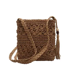 Woven straw crossbody bag for women, handmade hollow shoulder bag for summer beach.