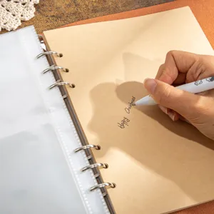 Kraft paper DIY scrapbook photo album with binder rings for family memories and travel.
