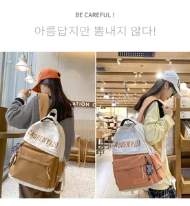 Zaino in tela elegante per donne e studenti con grande capacità e design bicolore moderno.
