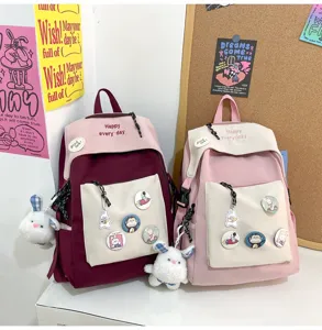 Casual student school backpack set with cute plush rabbit pendant and cartoon pins details.