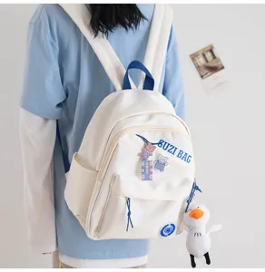 Casual white small backpack for women, cute Japanese style waterproof daypack for daily street wandering.