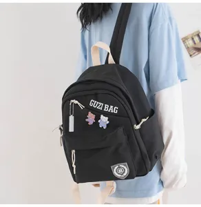 Compact black backpack for women, cute Japanese style daily casual mini bookbag with zipper.