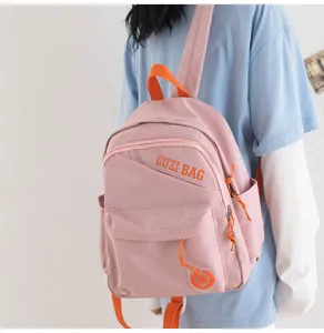 Compact pink casual backpack with vibrant orange straps and front pocket for daily outings.