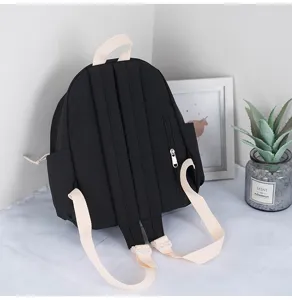 Compact black mini backpack with beige straps, casual daily school bag and outdoor daypack.