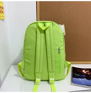 Lime green canvas backpack for women, large capacity casual school bag with back zipper pocket.