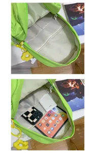 Detailed interior view showing multi-compartment storage capacity of the green canvas backpack.