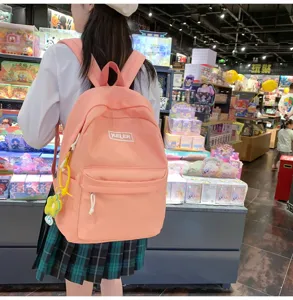 Pink canvas college style backpack for women, large capacity casual daypack detail view.