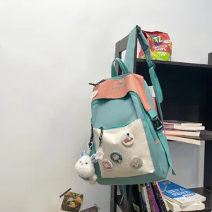 Casual color-block backpack for students, stylish multi-pocket daypack with cute pendants.