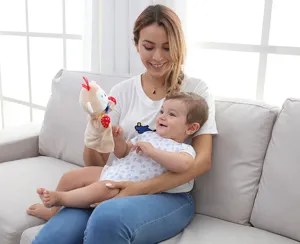 Detailed close-up view of a cute plush animal hand puppet, interactive toy for early education.