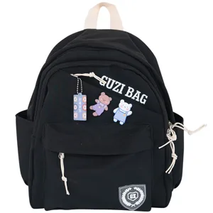 Compact black canvas backpack for women, stylish daily casual daypack with cute bear charms.
