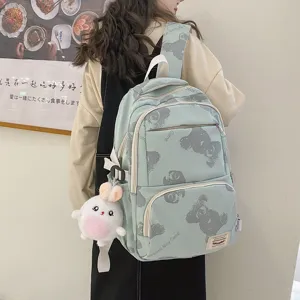 Cute Korean style canvas backpack for women students, trendy bear print school bag with rabbit pendant.