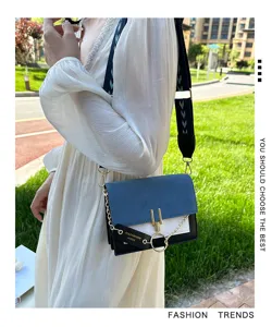 Stylish color-block shoulder bag for women with wide strap and chain detail fashion.