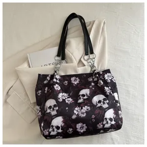 Schwarze Canvas-Tragetasche mit gotischem Totenkopf- und Blumenmuster, stylische Damentasche.