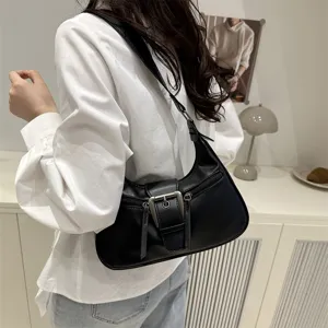 Black crescent shoulder bag for women, retro hobo purse with front buckle and stylish design.