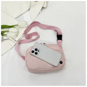Pink nylon crossbody phone bag, lightweight casual canvas shoulder bag with adjustable strap.