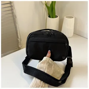 Black nylon crossbody bag for women, lightweight casual shoulder bag with adjustable strap.