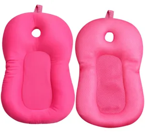 Pink baby bath cushion detail view, breathable mesh and soft padding, ergonomic newborn support.