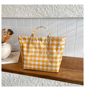 Yellow and white checkered canvas tote bag, casual large capacity handbag detail view.