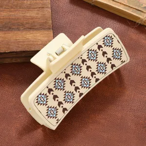 Detail view of a retro PU geometric print hair claw clip, simple vintage hair accessory for women.