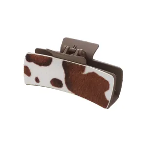 Retro PU cow print hair claw clip for women, stylish brown aesthetic hair accessories.