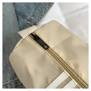 Nylon color-block pillow bag zipper detail, casual large capacity travel shoulder bag.