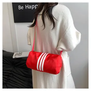 Detail view of red nylon barrel bag with white stripes, casual shoulder bag for daily use.