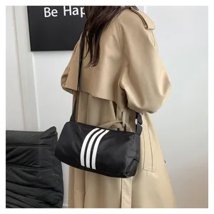 Close-up detail of the casual nylon cylindrical shoulder bag with stylish stripes.