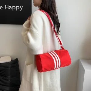 Red nylon cylindrical shoulder bag casual sports crossbody duffel bag with white stripes.