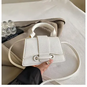 Minimalist white handbag detail shot, elegant curved design shoulder crossbody bag for women.