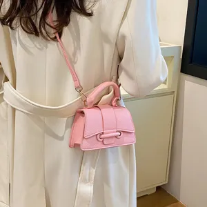 Pink minimalist top handle crossbody bag for women, stylish new autumn shoulder purse.