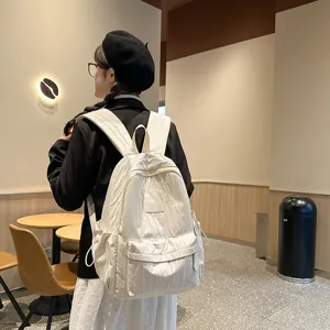 Stylish casual backpack for women, minimalist design daily school bag with crinkled fabric.