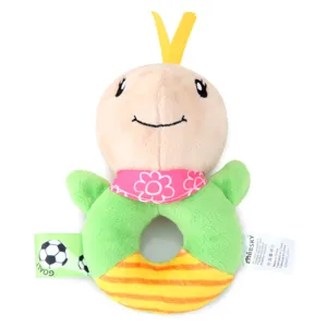 Detail shot of plush baby rattle toy with cute cartoon animal design and colorful fabric tags.