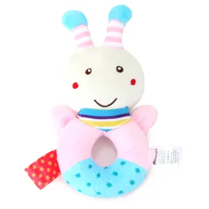 Close-up of cute cartoon animal plush baby rattle toy, soft fabric with colorful rings and tags.