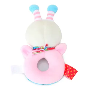 Plush baby hand rattle toy with pink ring grip, cute striped antennas and colorful ribbon.