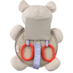 Close-up of baby car mirror toy plush bear design with safety mirror and hanging rings.