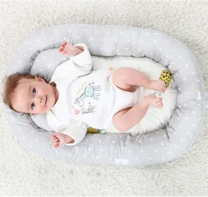 Detailed view of portable baby nest infant bed with comfortable cushion for newborn sleep safety.