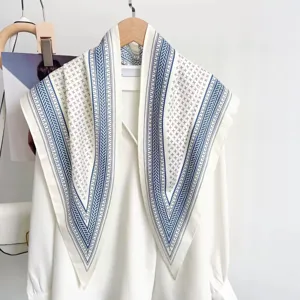 Detailed view of the vintage striped triangle scarf, elegant white twill fabric design.