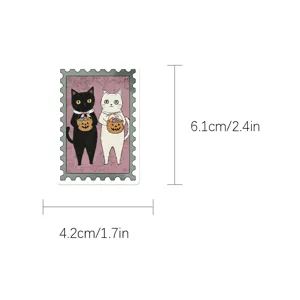 Vintage Halloween stamp sticker detail showing cute black and white cats with pumpkin basket.