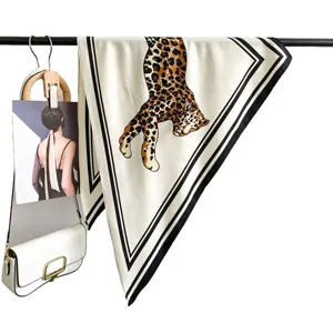 Vintage luxury leopard print triangular silk scarf, elegant retro fashion accessory for women.