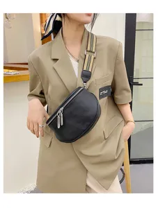 Black genuine leather saddle bag for women featuring a stylish patterned wide strap.