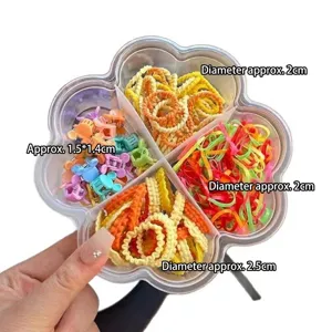Conjunto de coleteros coloridos y mini pinzas de pelo para niños en caja floral.